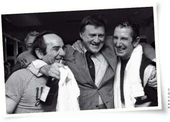  ??  ?? The late Yankees’ owner George Steinbrenn­er hugs coach Yogi Berra (left) and manager Billy Martin as they celebrate victory with champagne in 1976.