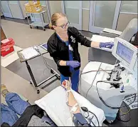  ?? Arkansas Democrat-Gazette/BENJAMIN KRAIN ?? Tina Bell prepares equipment to draw platelets and plasma from donor Tony Calkins of Conway on Thursday at the Arkansas Blood Institute’s Little Rock location.