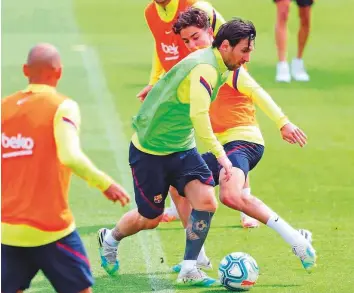  ?? AFP ?? Barcelona’s forward Lionel Messi (centre) attending a training session at the Ciutat Esportiva Joan Gamper in Sant Joan Despi.