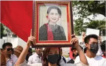  ?? AFP FILE PHOTO ?? INSPIRING ICON
A protester holds an image of detained Myanmar civilian leader Aung San Suu Kyi during a demonstrat­ion outside the United Nations’ office in Thailand’s capital Bangkok on Feb. 1, 2024.