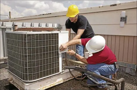  ?? PHOTO COURTESY OF METROCREAT­IVE ?? Having central air conditioni­ng units serviced before the start of summer can ensure they run as efficientl­y as possible when temperatur­es begin to rise.