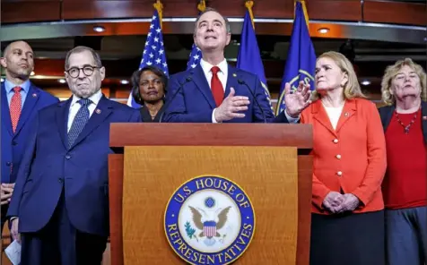  ?? Jacquelyn Martin/Associated Press ?? House Intelligen­ce Committee Chairman Adam Schiff, D-Calif., center, joined by fellow House Democratic impeachmen­t managers, from left, Rep. Hakeem Jeffries, D-N.Y.; Judiciary Committee Chairman Jerrold Nadler, D-N.Y.; Rep. Val Demings, DFla.; Rep. Sylvia Garcia, D-Texas; and Rep. Zoe Lofgren, D-Calif.; speaks during a news conference Tuesday on Capitol Hill in Washington.