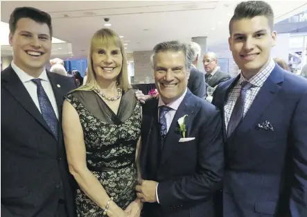  ?? NICK LEES ?? Sam Abouhassan, centre, and wife Angela with sons Rasheed, 21, left, and Naseem, 19, during Sam’s recognitio­n at the Salute to Excellence awards and induction into the Edmonton Hall of Fame.