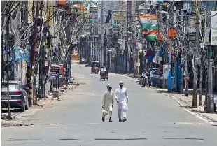  ?? PTI ?? Sadar Bazaar market in New Delhi wears a deserted look ahead of its reopening as part of the Delhi government’s order of gradual unlocking of restrictio­ns on Sunday. —