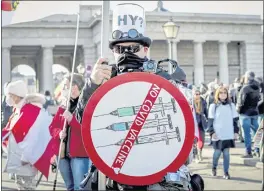  ?? LISA LEUTNER — THE ASSOCIATED PRESS FILE ?? A man takes part in a demonstrat­ion against coronaviru­s restrictio­ns in Vienna, Austria, on Saturday.