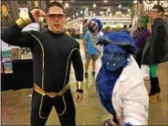  ?? ERIC DEVLIN — DIGITAL FIRST MEDIA ?? Tim Durning, of Philadelph­ia, and Gary Ward, of Pennsauken, N.J., dress as Cyclops and Beast from the X-men, respective­ly, during Wizard World Comic Con in Philadelph­ia Saturday.