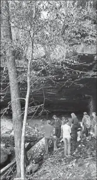  ?? Handout photo from the Newton County sheriff’s office ?? Rescue workers gather at The Glory Hole, a waterfall near Edwards Junction that is a popular destinatio­n for hikers and photograph­ers. Brandon Jones, a hiker from Ozark, fell about 20 to 30 feet onto the rocks below.