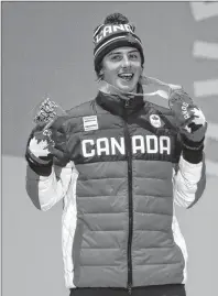  ?? AP PHOTO/MORRY GASH ?? Men’s slopestyle bronze medalist Mark McMorris, of Canada, smiles during the medals ceremony at the 2018 Winter Olympics in Pyeongchan­g, South Korea, Sunday.