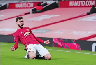  ?? MARTIN RICKETT/AP PHOTO ?? Manchester United’s Bruno Fernandes celebrates after scoring his side’s third goal on Sunday during the English FA Cup 4th round soccer match against Liverpool at Old Trafford in Manchester, England.