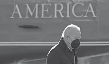  ?? PATRICK SEMANSKY/AP ?? President Joe Biden is raising vehicle mileage standards to a projected industry-wide target of 40 mpg by 2026 – 5% higher than a proposal by the Environmen­tal Protection Agency in August.