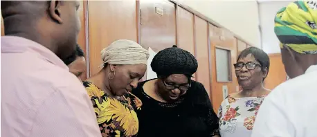  ?? | TUMI PAKKIES/AFRICAN NEWS AGENCY (ANA) ?? SLAIN Philisiwe Mvubu’s family gathered in prayer after her husband’s sentencing yesterday.