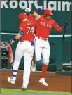  ?? Richard Rodriguez SAM HUFF Getty I mages ?? and the Rangers beat the Astros, who clinched a playoff berth when Angels lost.