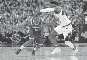  ?? JOHN E. SOKOLOWSKI / USA TODAY SPORTS ?? Milwaukee Bucks guard Eric Bledsoe tries to get around Toronto Raptors guard Terence Davis on Tuesday night.