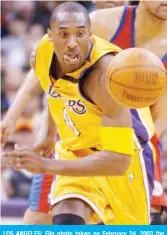  ??  ?? LOS ANGELES: File photo taken on February 24, 2003 the ball eludes Los Angeles Lakers’ Kobe Bryant in the first quarter against the Los Angeles Clippers in Los Angeles, CA. — AFP