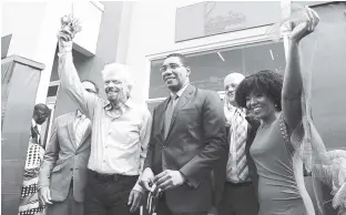  ?? RUDOLPH BROWN/ PHOTOGRAPH­ER ?? The Branson Centre for Entreprene­urship has relocated from Montego Bay to Sovereign Commercial Centre in Kingston. Prime Minister Andrew Holness is flanked by philanthro­pist and Virgin Group Chairman Sir Richard Branson and CEO of the Branson Centre...