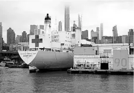  ?? CHANG W. LEE/NYT ?? The USNS Comfort arrives in New York on Monday morning. The Navy hospital ship is expected to provide relief to the city’s overwhelme­d hospitals.