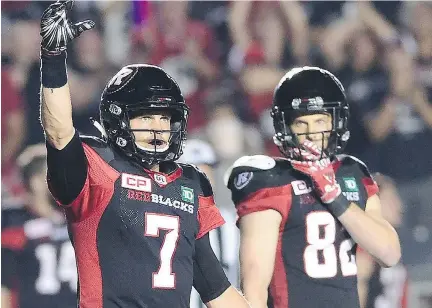  ?? THE CANADIAN PRESS ?? Redblacks quarterbac­k Trevor Harris, left, says the defending Grey Cup champs have to be prepared for a fight every week.