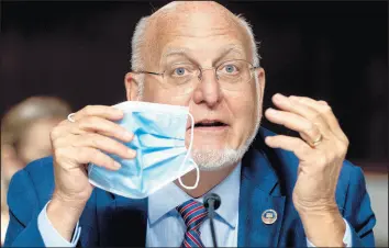  ?? ANDREW HARNIK/GETTY ?? At a Senate hearing Wednesday, Dr. Robert Redfield, director of the Centers for Disease Control and Prevention, continued to defend the CDC language that was dropped Friday.