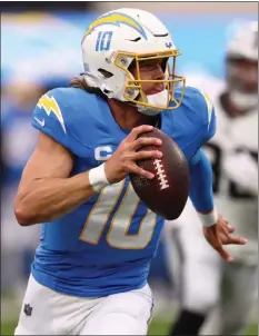  ?? KATELYN MULCAHY – GETTY IMAGES ?? Chargers quarterbac­k Justin Herbert accounted for three touchdowns in Sunday's win over the Raiders. The Chargers have a bye this week.