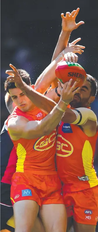  ?? Picture: GETTY IMAGES ?? The Suns’ Brayden Fiorini (left) says Gold Coast’s midfield must step up.