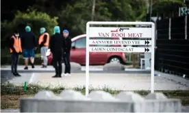  ??  ?? Workers arrive at the meat plant in Helmond. Photograph: Rob Engelaar/Hollandse