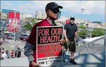  ?? ISAAC BREKKEN/AP PHOTO ?? Culinary Union members file into a university arena in Las Vegas on Tuesday to vote on whether to authorize a strike. A potential strike would affect 34 casino-hotels.