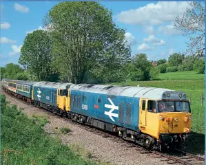  ??  ?? RIGHT: 50019
Ramillies leads 50026
Indomitabl­e towards Wymondham on the Mid Norfolk Railway with a service from Dereham on June 2, 2013. 50019 was the second Class 50 to be secured for preservati­on, being bought by the Class 50 Locomotive Associatio­n. It is currently undergoing an overhaul. Tom Mcatee