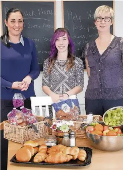  ??  ?? Opening Lisa Finlay, people manager at Tesco in Blairgowri­e, Becky Moran, chef at the Wellmeadow Cafe, and Teresa Donaldson, coordinato­r at SCYD