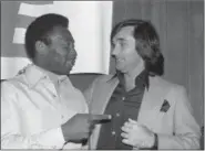  ?? GEORGE BRICH — THE ASSOCIATED PRESS FILE ?? In this file photo, Pele, left, and former Irish soccer star George Best, appear during an awards luncheon for Pele in Los Angeles.