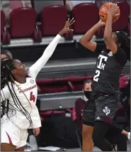  ?? (NWA Democrat-Gazette/J.T. Wampler) ?? Erynn Barnum of Arkansas tries to block a shot by Texas A&M’s Aaliyah Wilson on Sunday. Wilson led A&M with 27 points and eight rebounds.