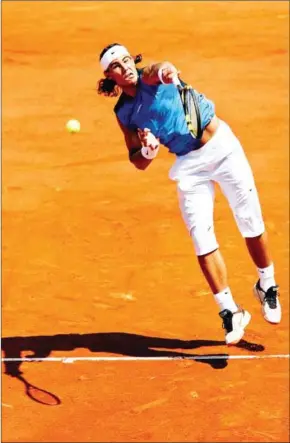  ?? AFP ?? Rafael Nadal serves to Novak Djokovic during the quarter-finals of the French tennis Open at Roland Garros in Paris on June 7, 2006.