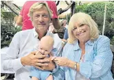  ??  ?? Family: Richard and Judy Madeley with their grandson, Kit