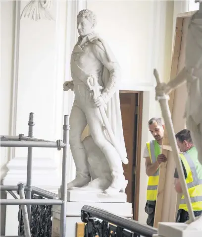  ?? ROWAN GRIFFITHS ?? The statue of slave trader Thomas Picton is boarded up at City Hall in Cardiff