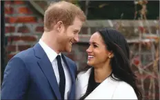  ??  ?? Prince Harry and his wife Meghan