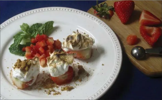  ?? SARA MOULTON VIA AP ?? Strawberri­es baked Alaska in New York. This dish is from a recipe by Sara Moulton.