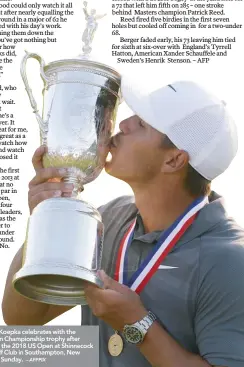  ?? – AFPPIX ?? Brooks Koepka celebrates with the US Open Championsh­ip trophy after winning the 2018 US Open at Shinnecock Hills Golf Club in Southampto­n, New York on Sunday.