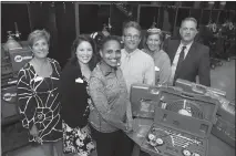  ?? PHOTO COURTESY OF CSM ?? From left, Michelle Goodwin, CSM vice president of advocacy and community engagement, Chelsea Brown, CSM executive director of developmen­t, Serwa Groves of Atlas Foundation­s of Washington, Bruce Posey, CSM Regional Hughesvill­e Campus director, Kelly Winters, CSM executive director of workforce developmen­t, and Dan Mosser, CSM vice president of continuing education and workforce developmen­t, show off the new gas welding and cutting torch kits in the welding shop.