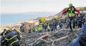  ?? Photo / AP ?? Rescuers at work after heavy rain triggered landslides in Casamiccio­la, on the Italian island of Ischia.