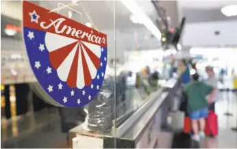  ?? Carlos Avila Gonzalez / The Chronicle ?? Independen­ce Day decoration­s adorn the Amtrak station in Emeryville. The proposed federal budget would end long-distance Amtrak service nationwide.