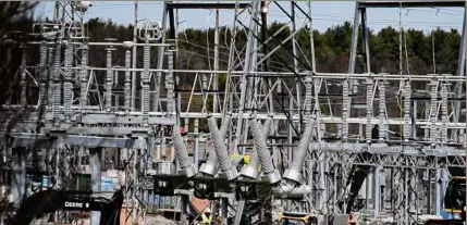  ?? ?? National Grid is is responding to aggressive new climate change laws being put into effect in both New York and Massachuse­tts by promising a transition to clean energy by 2050.