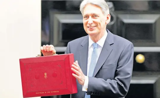  ??  ?? > Chancellor Philip Hammond before delivering last week’s Budget.