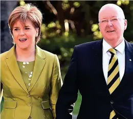  ??  ?? Under pressure: Nicola Sturgeon and husband Peter Murrell