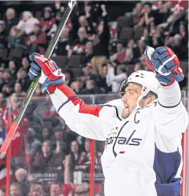  ??  ?? The Capitals’ Alex Ovechkin celebrates his third period empty-net goal.