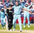  ?? (Reuters) ?? IN AN incredibly dramatic final yesterday at Lord’s, Chris Woakes (front) and England needed a Super Over to defeat New Zealand and capture the World Cup title.