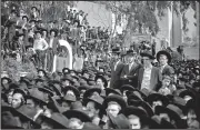  ?? AP/ARIEL SCHALIT ?? Ultra-Orthodox Jews gather during the funeral of Rabbi Shmuel Auerbach in Jerusalem on Sunday.