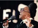  ?? BARBARA J. PERENIC/COLUMBUS DISPATCH ?? Pastor Priscilla Woodson sings at a memorial gathering for Robert “Babachu” Spriggs at Miracle Cathedral on the Near East Side.