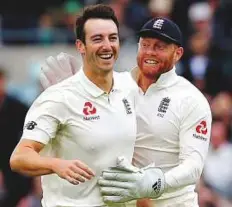  ?? Reuters ?? England’s Toby Roland-Jones (left) celebrates the wicket of South Africa’s Quinton de Kock with wicketkeep­er Jonny Bairstow. South Africa ended the second day at 126/8.