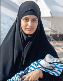  ??  ?? ‘HARDCORE’: Shamima Begum leaving Gatwick Airport to join IS in 2015 and, right, with baby Jarrah in Syria in February