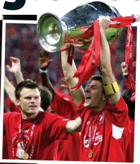  ??  ?? PAINT IT RED: Gerrard lifts European Cup after the mother of all comebacks