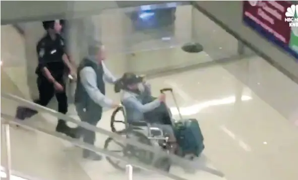  ??  ?? A NBC video grab shows Marilou Danley, Stephen Paddock’s girlfriend, passing through the Los Angeles airport in a wheelchair. — NBC